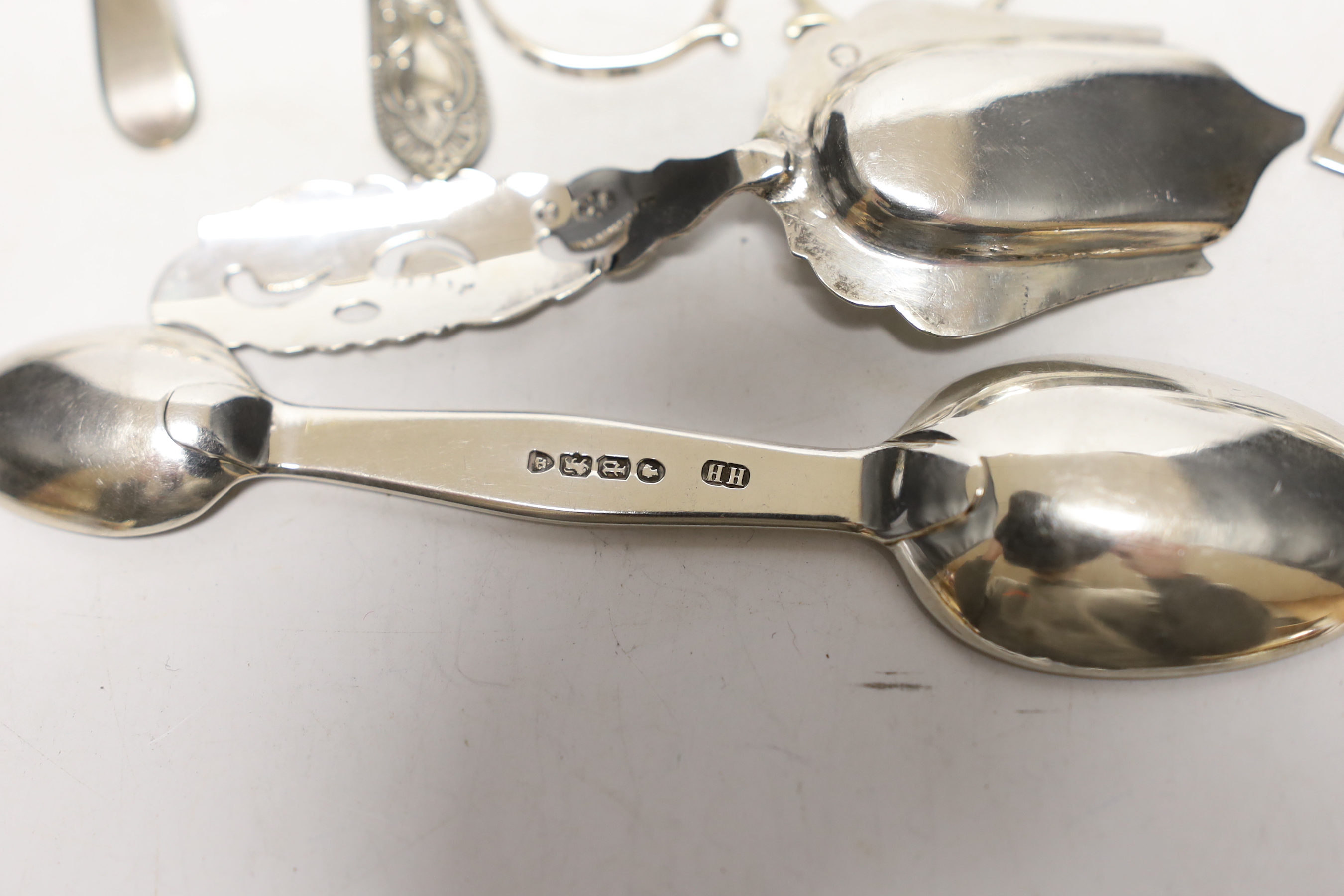 A small quantity of assorted silver flatware etc. including spoons, caddy spoon, condiment spoons, 18th century mote spoon and two pairs of sugar nips.